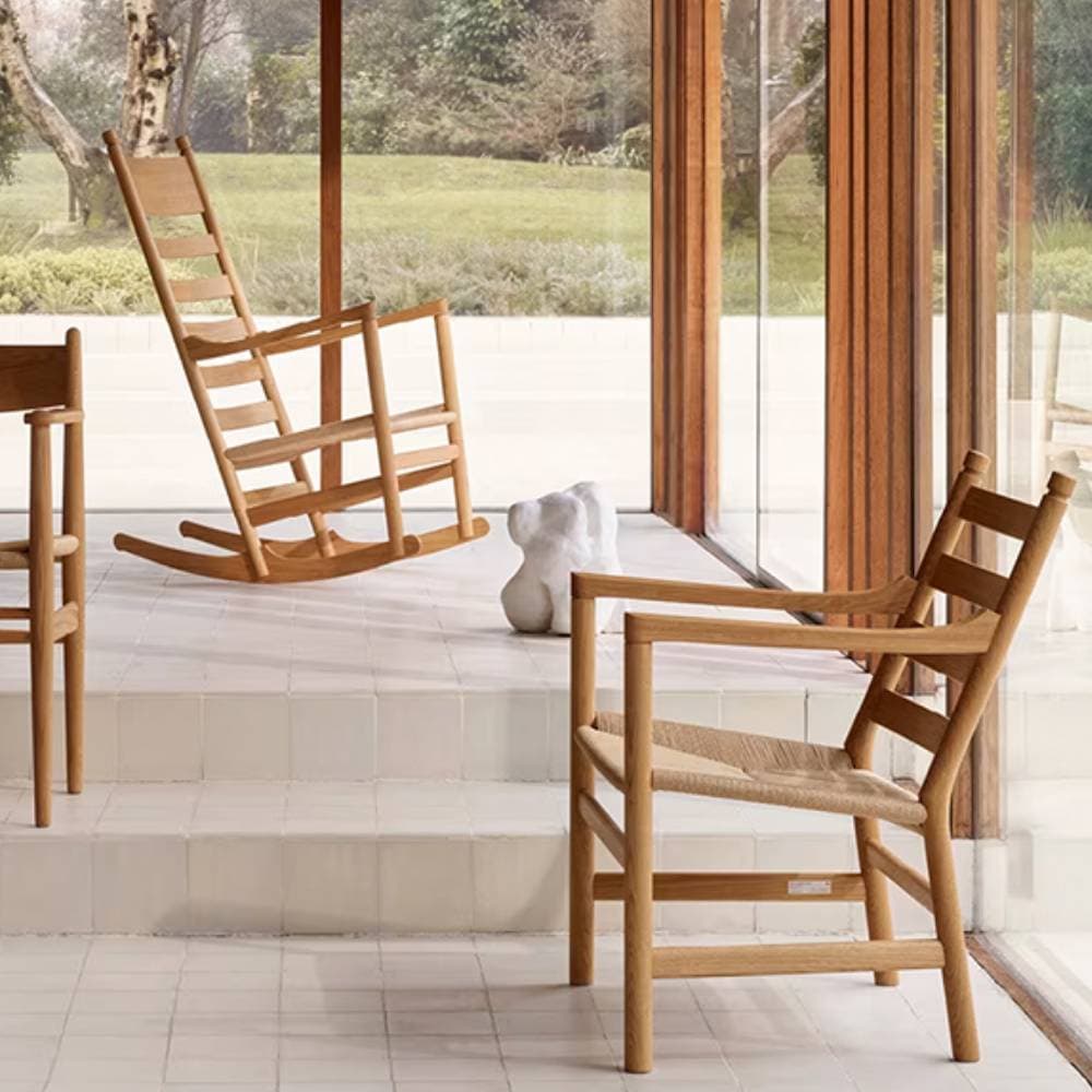 Living room with panorama windows and chairs from Carl Hansen & Søn