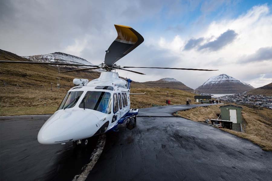 A helicopter on the ground in the Faroe Islands