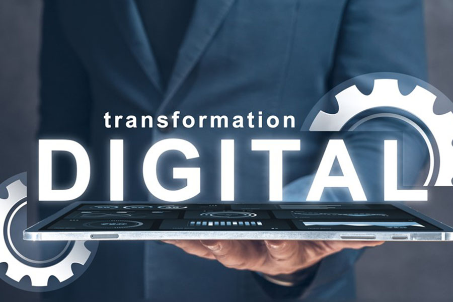 A touchscreen and the words transformation and digital