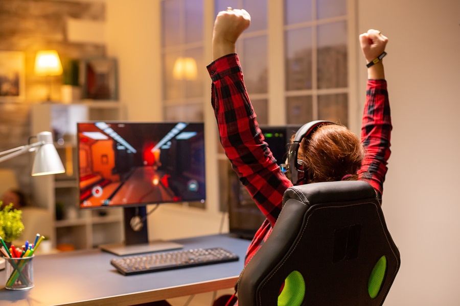Happy gamer winning a online video game