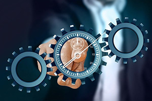 3 wheels with a clock in the middle